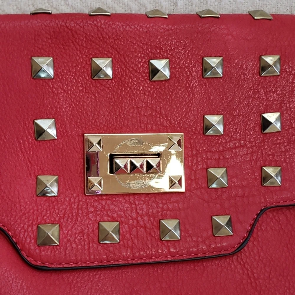 RED studded-embellished lipstick red vegan leather shoulder bag